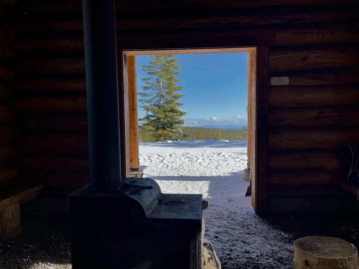 Snowy cabin window scene shared on Instagram by Recreation Leader.