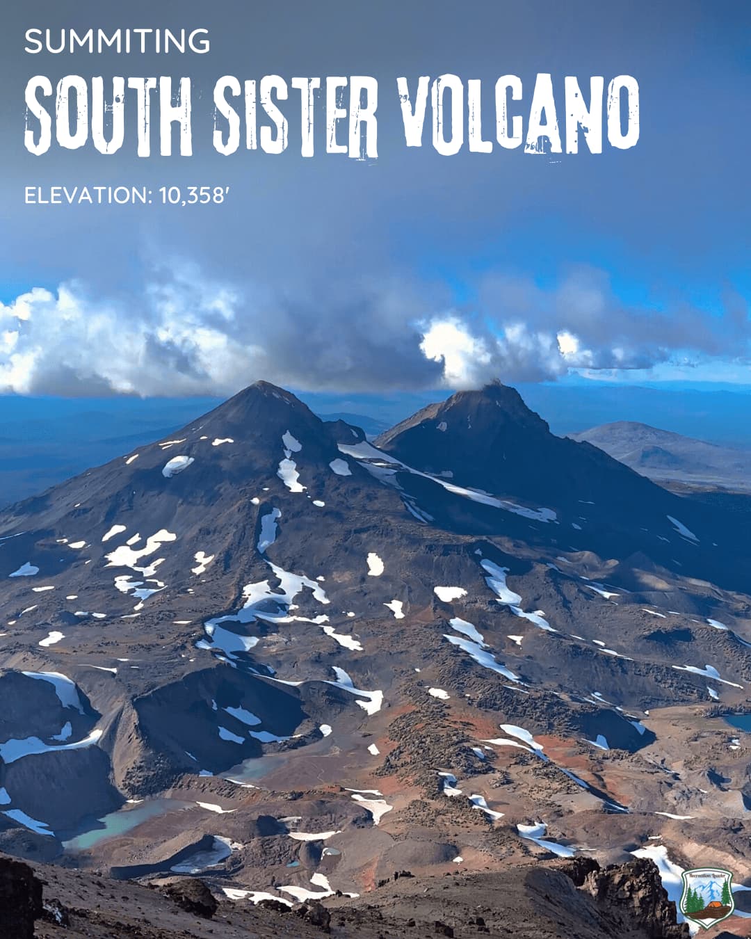 Summiting South Sister Volcano at 10,358 feet with snow patches and blue sky